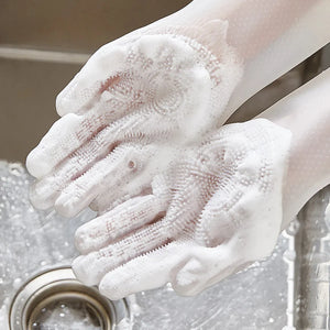 Pettechhair white silicone grooming gloves with soft bristles lathered in soap over sink for pet bathing