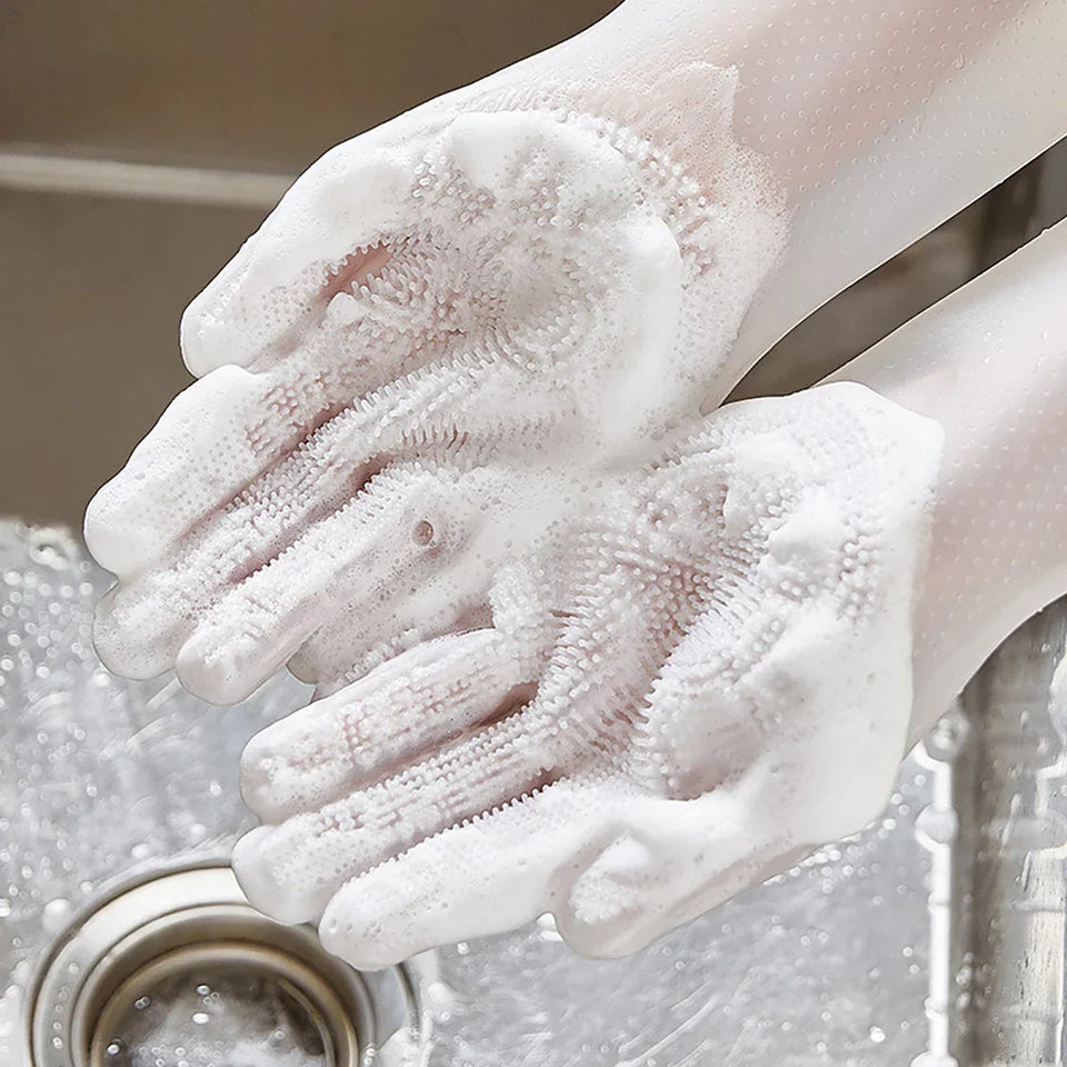 Pettechhair white silicone grooming gloves with soft bristles lathered in soap over sink for pet bathing