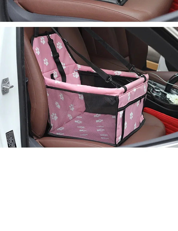 pettechhair pink pet car booster seat with white paw prints and safety straps on vehicle passenger seat