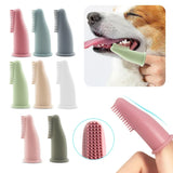 pettechhair silicone finger toothbrush for dogs in assorted pastel colors cleaning teeth of a smiling dog