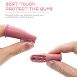 pettechhair pink silicone dog finger toothbrush with soft bristles held between hands to protect gums